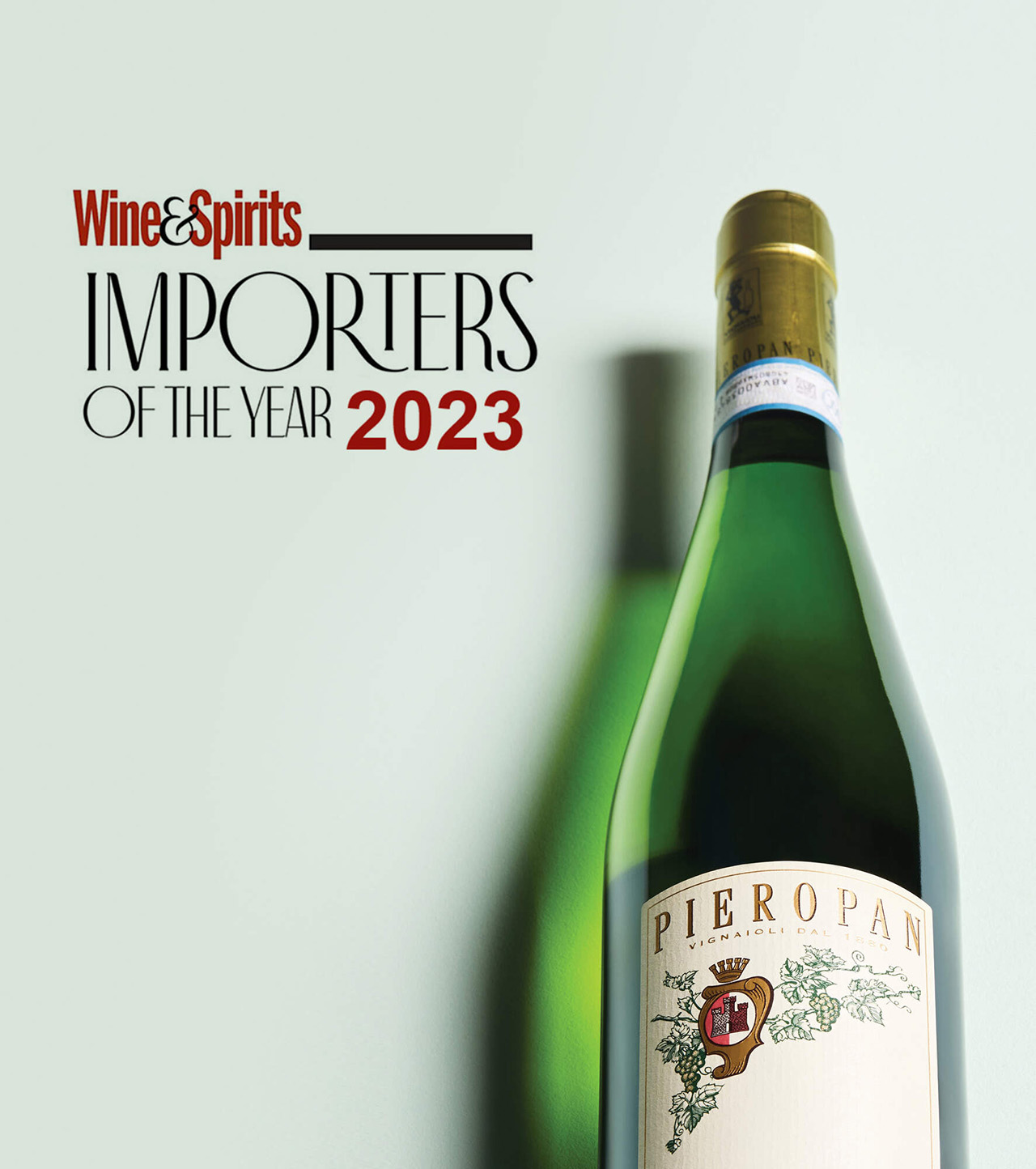 Wine & Spirits Importers of the year 2023 title next to a bottle of Pieropan wine