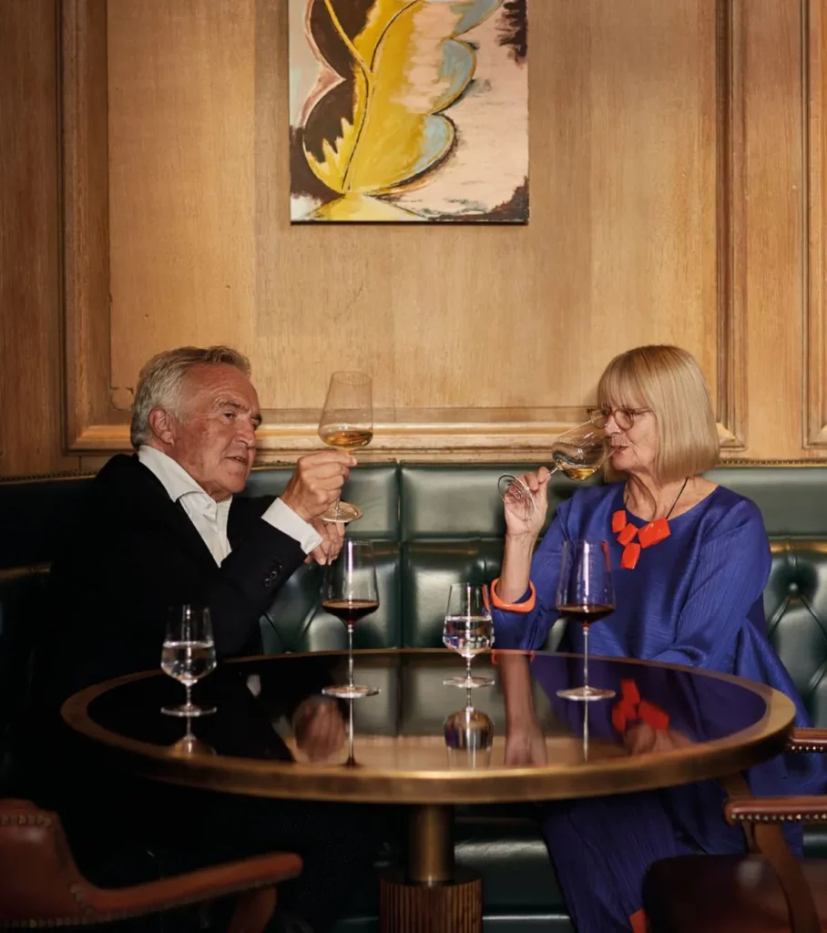 Two people enjoying wine at a table