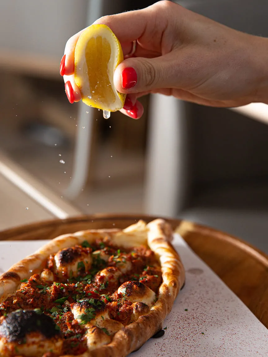 Squeezed lemon over a flatbread
