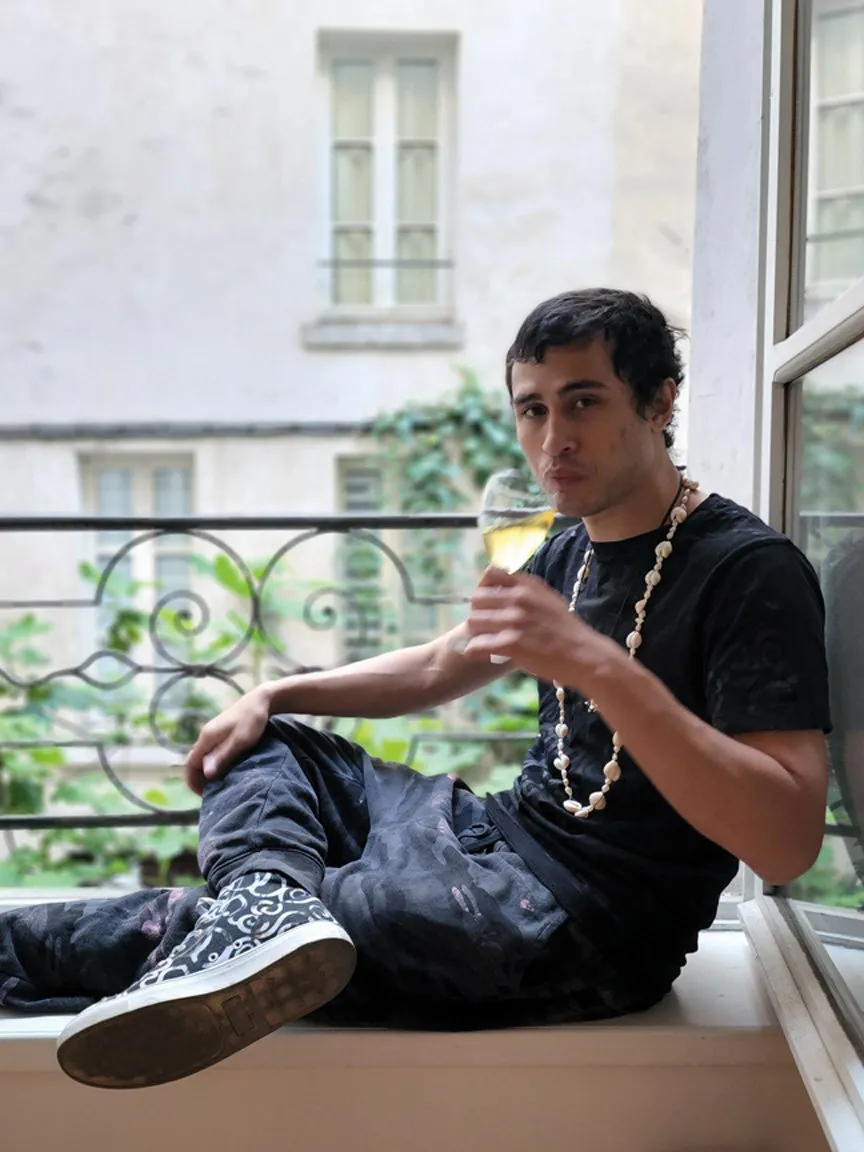 Skinny Pablo enjoying a glass of wine in Paris