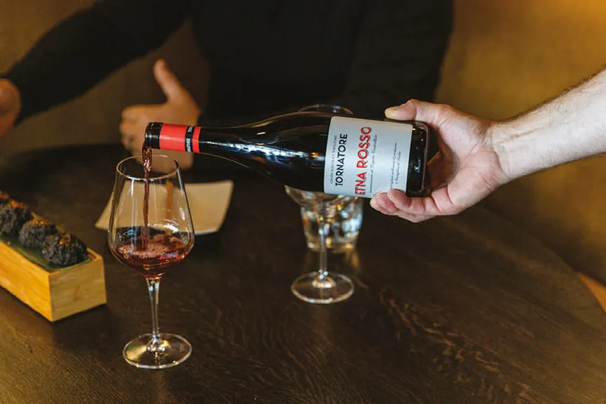 Wine being poured into a glass