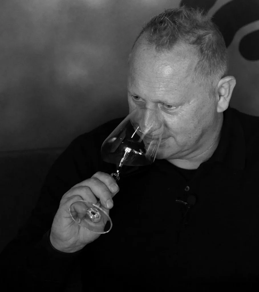 Chotto Matte tasting a bottle of wine