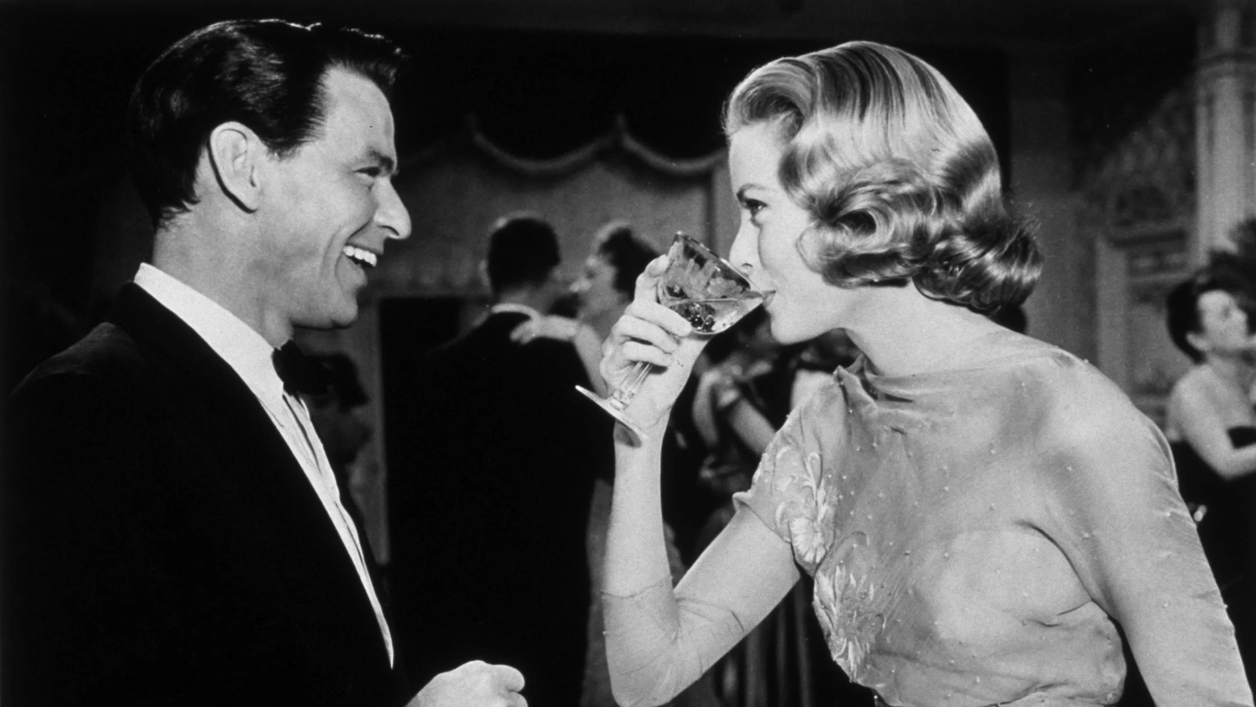 Old image of two people enjoying Champagne