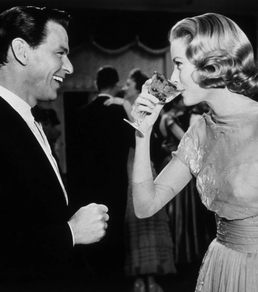 Old image of two people enjoying Champagne